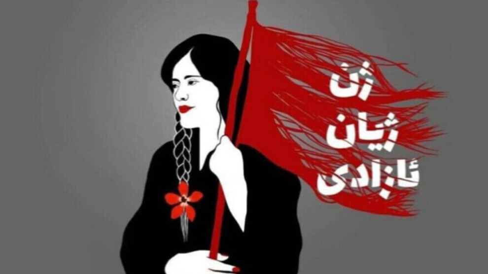 Natpis na zastavi, na kurdskom jeziku: „Žene, život, sloboda“